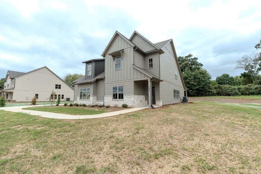 Front exterior of a new home in , Hoschton, GA, highlighting curb appeal (Image 29).