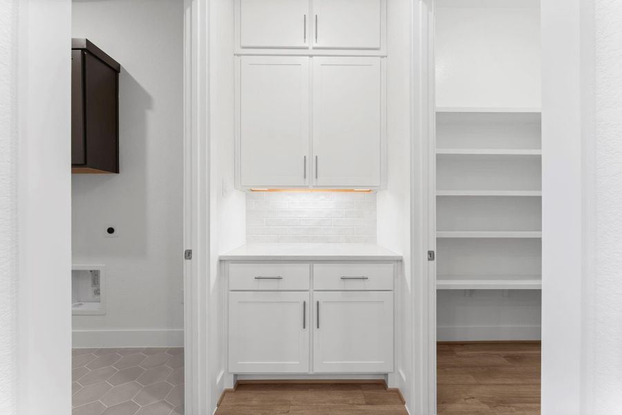Butler's pantry between the utility room and pantry. Butler's pantry between the utility room and pantry.