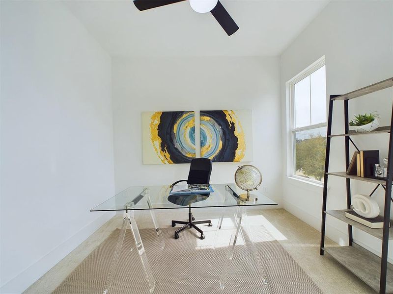 One of two secondary bedrooms, this space can serve as a guest suite, home office, or a combination of both in order to best suit your needs! *All interior photos are from the model home: 9007 Orange Springs Dr.*