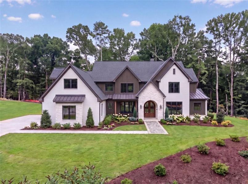 Front exterior of a new home in , Loganville, GA, highlighting curb appeal (Image 6). Front exterior of a new home in , Loganville, GA, highlighting curb appeal (Image 6).