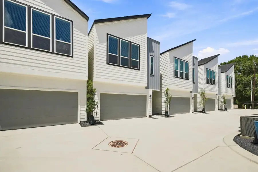 Attractive contemporary elevation showcasing modern architectural details, contrasting finishes, and an attached two-car garage. Attractive contemporary elevation showcasing modern architectural details, contrasting finishes, and an attached two-car garage.