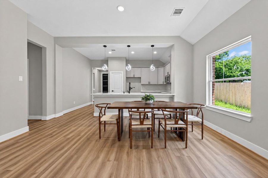 Open dining area seamlessly connected to the living space, ideal for gatherings and everyday meals.