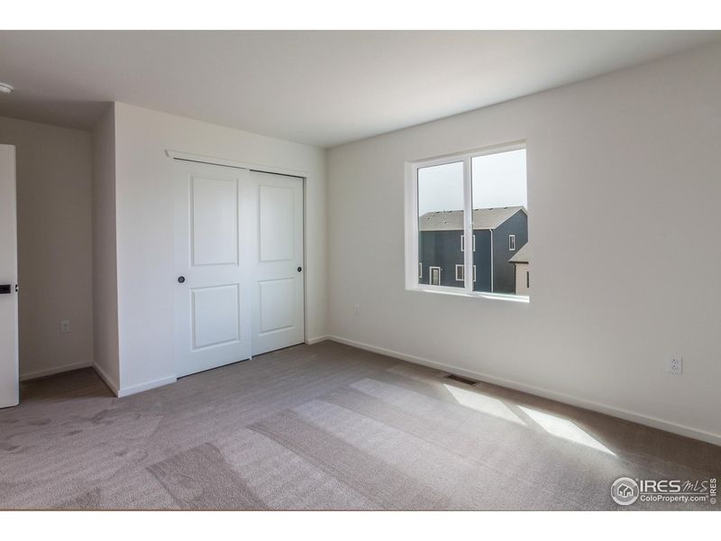 Spacious, unfurnished interior of a new home in Granary Trailblazer Collection - Single Family Homes, Johnstown (Image 26).