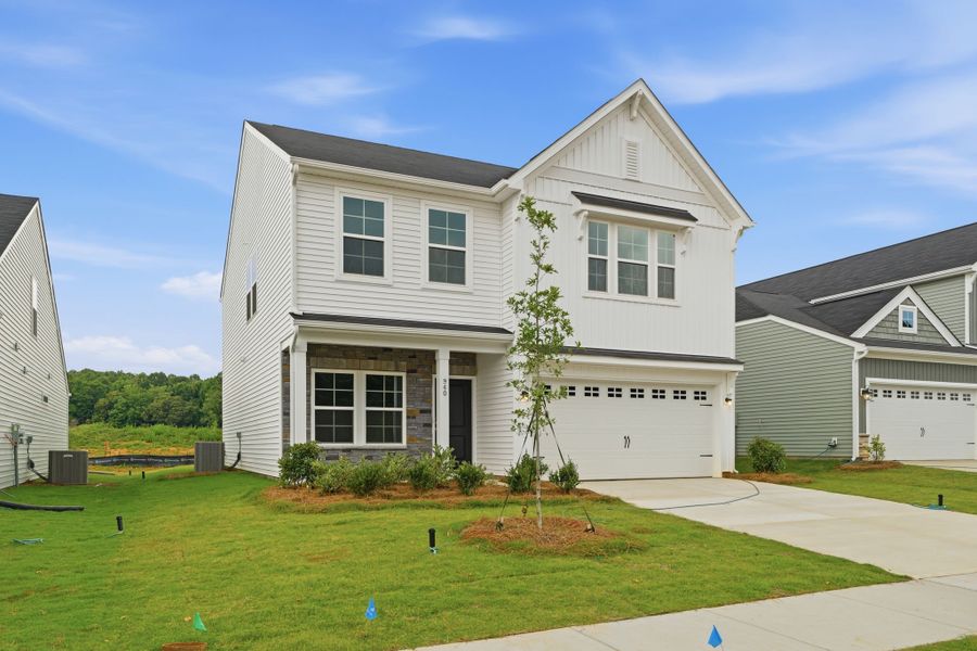 Front exterior of a new home in Piper Creek, Newton, NC, highlighting curb appeal (Image 2). Front exterior of a new home in Piper Creek, Newton, NC, highlighting curb appeal (Image 2).