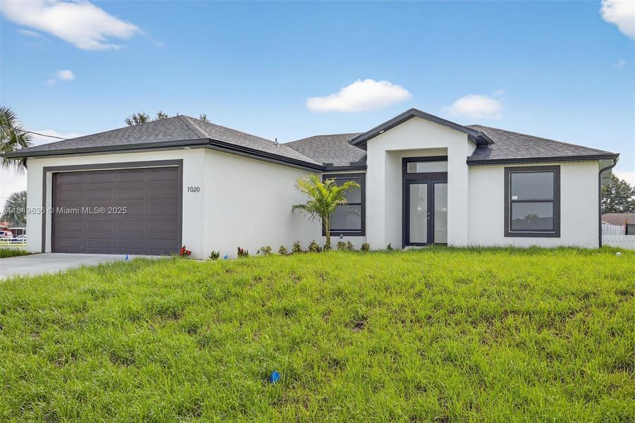 Front exterior of a new home in , Lehigh Acres, FL, highlighting curb appeal (Image 1). Front exterior of a new home in , Lehigh Acres, FL, highlighting curb appeal (Image 1).