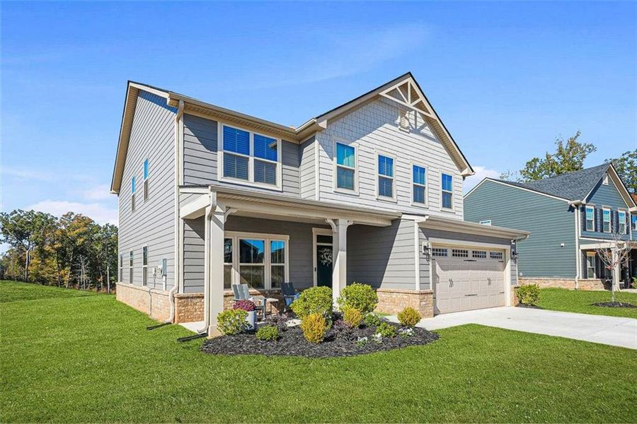 Front exterior of a new home in Southern Hills, McDonough, GA, highlighting curb appeal (Image 29).