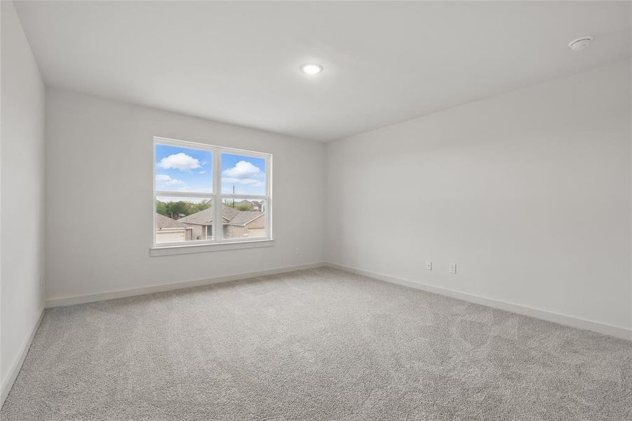 Spare room featuring baseboards, recessed lighting, and light colored carpet Spare room featuring baseboards, recessed lighting, and light colored carpet