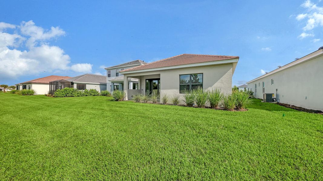 Exterior details and patio area of a home in Palm Grove Real Estate and Homes for Sale in Lakewood Ranch, FL - Neal Communities, Lakewood Ranch (Image 26). Exterior details and patio area of a home in Palm Grove Real Estate and Homes for Sale in Lakewood Ranch, FL - Neal Communities, Lakewood Ranch (Image 26).
