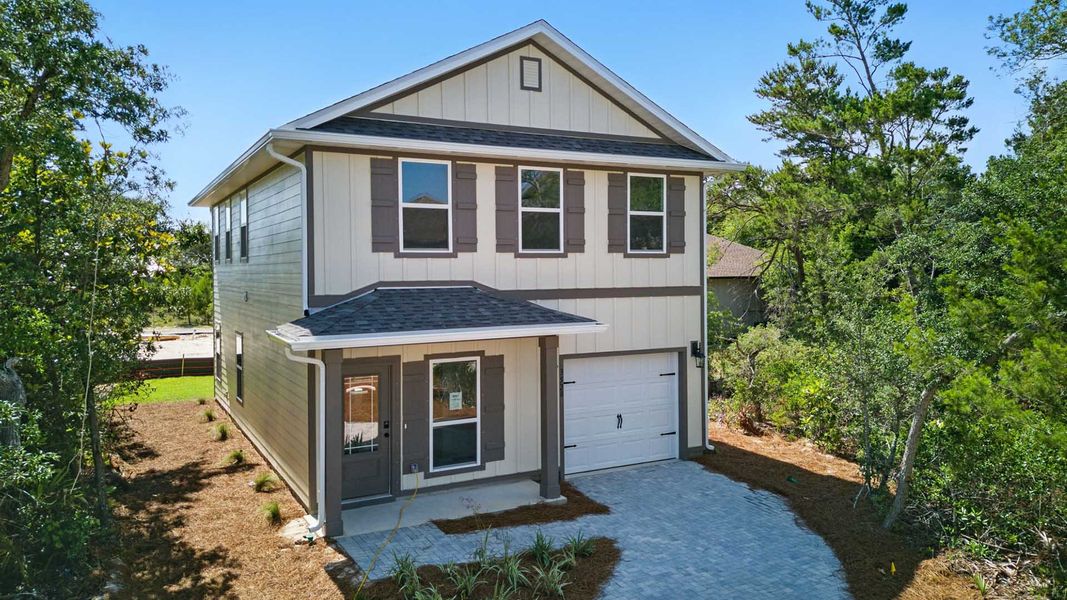 Front exterior of a new home in Sanctuary Beach, Panama City Beach, FL, highlighting curb appeal (Image 2).