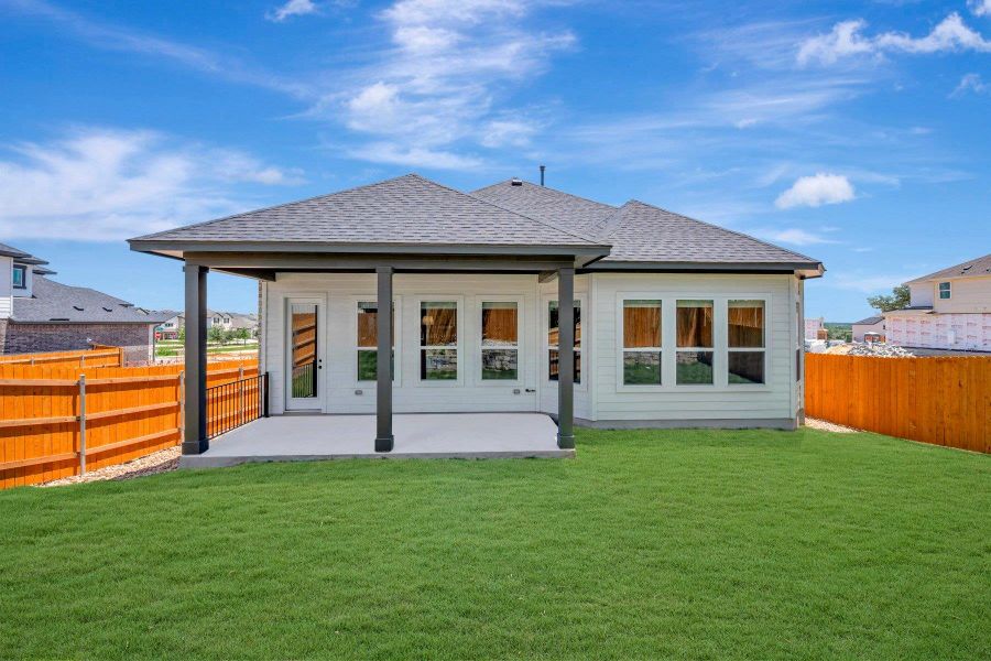 Exterior details and patio area of a home in Heritage, Dripping Springs (Image 15).