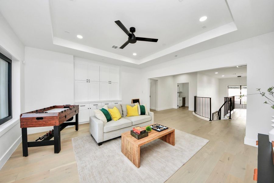 This game room is designed for evenings of air hockey, poker, or casual gatherings with friends and family.