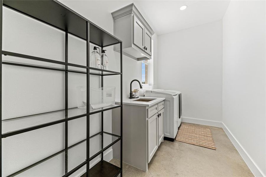 Washroom featuring cabinet space, independent washer and dryer, and recessed lighting Washroom featuring cabinet space, independent washer and dryer, and recessed lighting