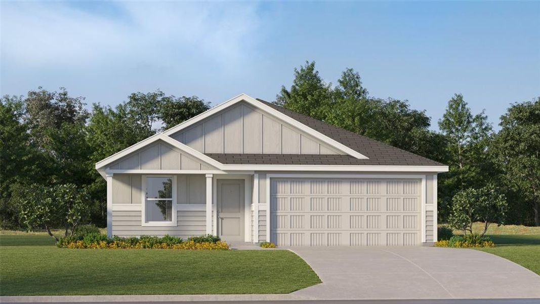 View of front of property featuring a front yard and a garage