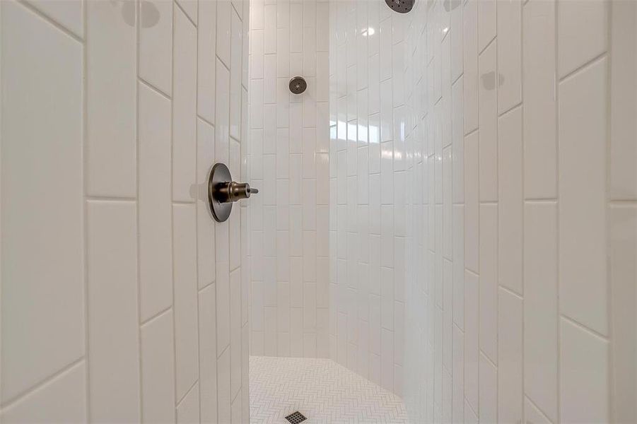 Room details featuring tiled shower