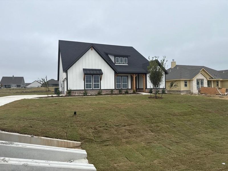 Front exterior of a new home in Fairview Meadows, New Fairview, TX, highlighting curb appeal (Image 13). Front exterior of a new home in Fairview Meadows, New Fairview, TX, highlighting curb appeal (Image 13).