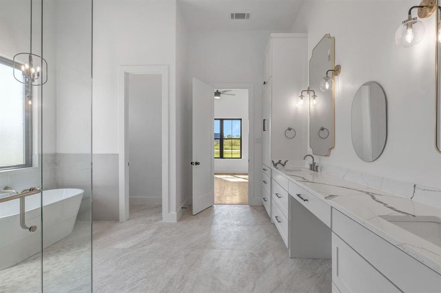 Full bath featuring a soaking tub, double vanity.