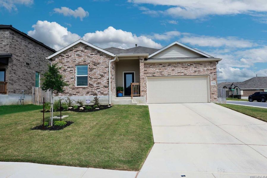 Front exterior of a new home in Hidden Trails, Bulverde, TX, highlighting curb appeal (Image 23).