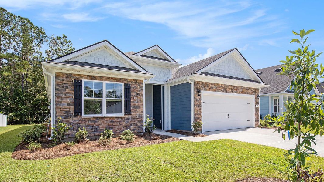 Front exterior of a new home in The Bluffs at Mill Creek, Florence, SC, highlighting curb appeal (Image 2). Front exterior of a new home in The Bluffs at Mill Creek, Florence, SC, highlighting curb appeal (Image 2).