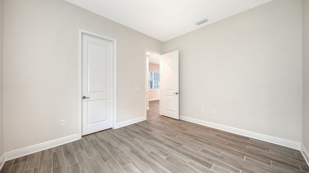 Spacious, unfurnished interior of a new home in Canoe Creek Real Estate and Homes for Sale in Parrish, FL - Neal Communities, Parrish (Image 55).