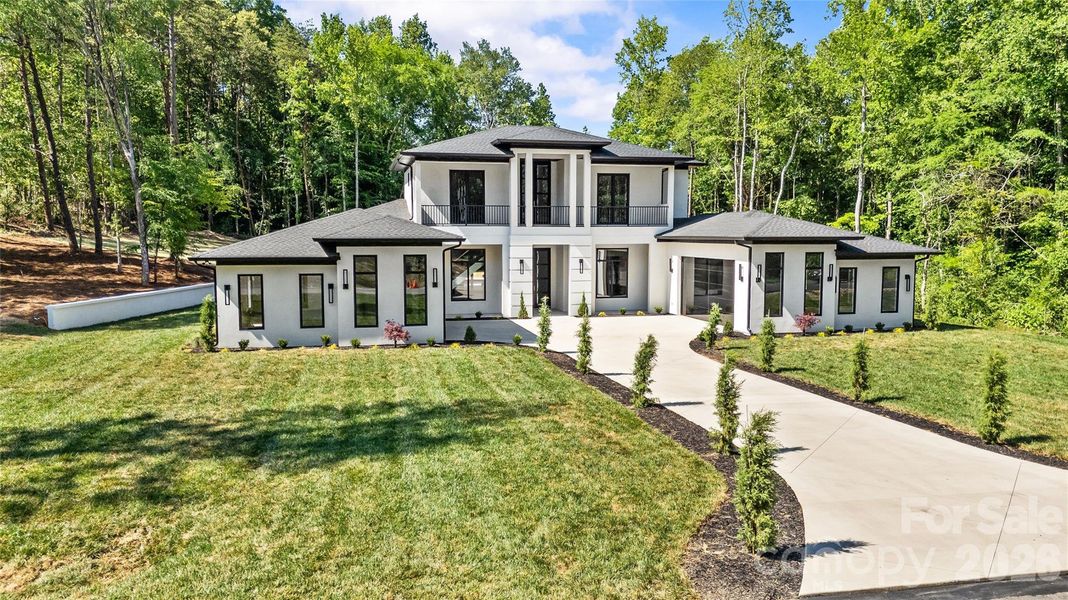 Front exterior of a new home in , Davidson, NC, highlighting curb appeal (Image 20).