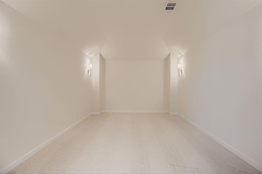 Additional living space featuring light colored carpet Additional living space featuring light colored carpet