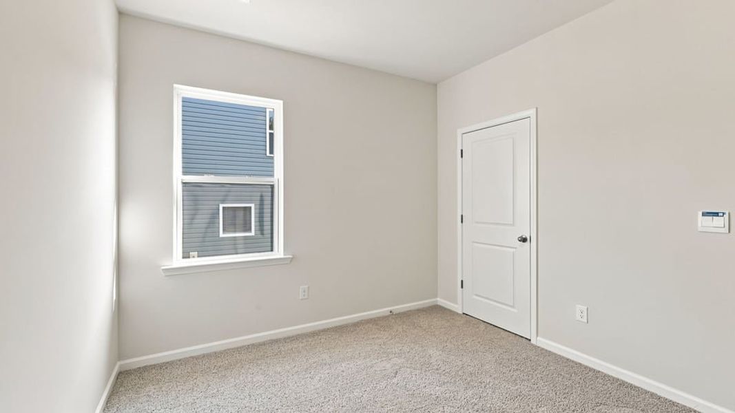 Spacious, unfurnished interior of a new home in Durbin Meadows Traditions, Fountain Inn (Image 18).