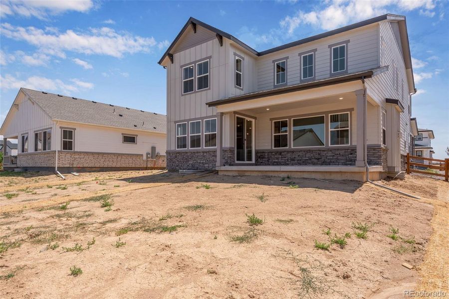 Front exterior of a new home in Prelude at The Aurora Highlands, Aurora, CO, highlighting curb appeal (Image 2). Front exterior of a new home in Prelude at The Aurora Highlands, Aurora, CO, highlighting curb appeal (Image 2).