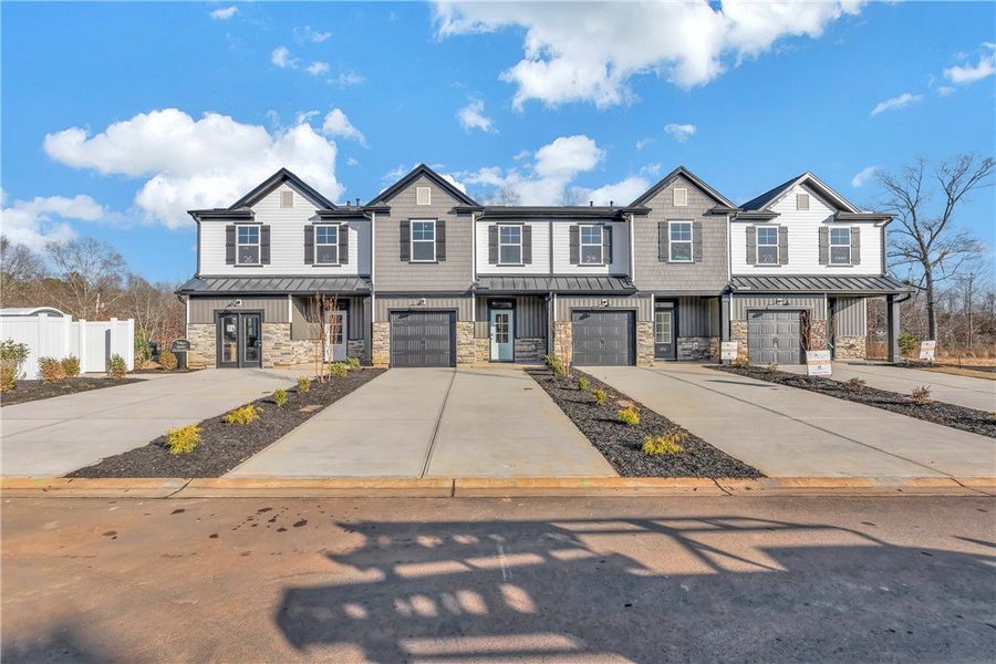 Front exterior of a new home in Meece Townhomes, Easley, SC, highlighting curb appeal (Image 17).