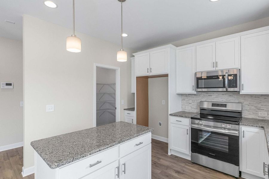 Representative furnished interior of a home built from the Magnolia by Caviness & Cates Communities in Bartlett Manor, Youngsville (Image 209).