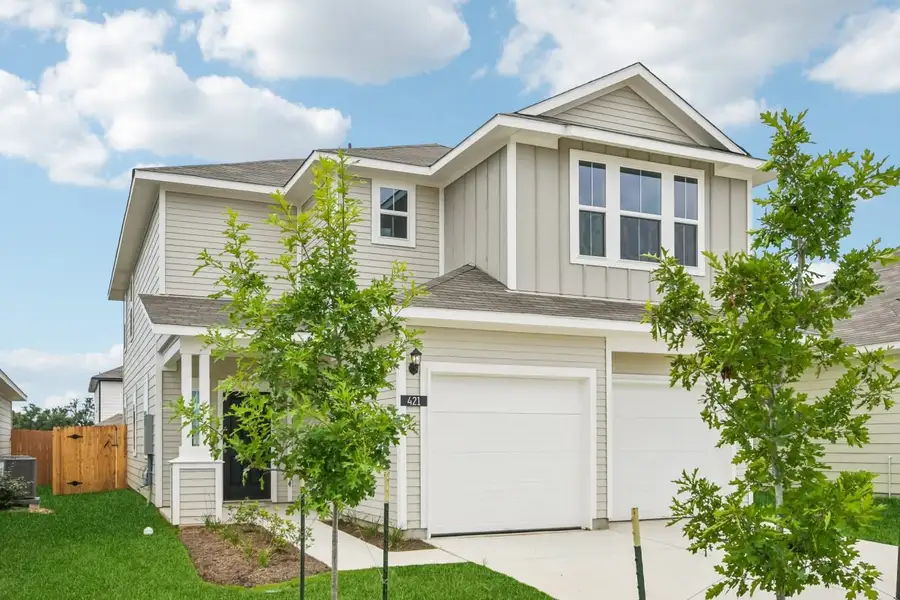 Front exterior of a new home in Cascade, Liberty Hill, TX, highlighting curb appeal (Image 2). Front exterior of a new home in Cascade, Liberty Hill, TX, highlighting curb appeal (Image 2).