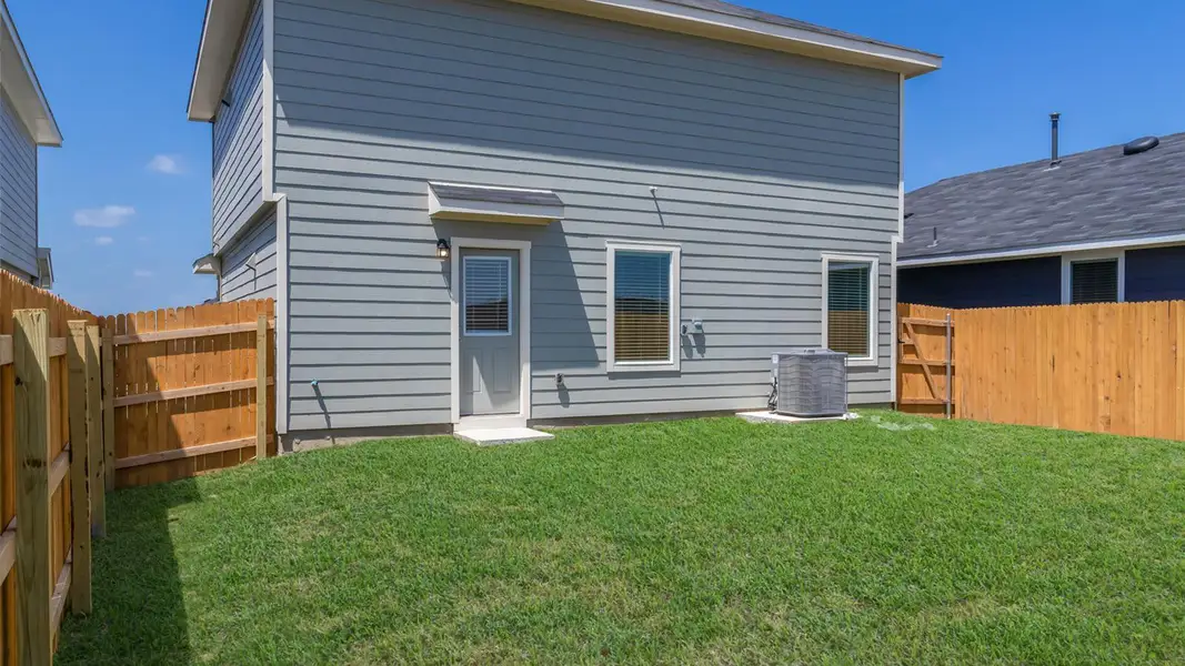 Exterior details and patio area of a home in Prairie Lakes, Buda (Image 15). Exterior details and patio area of a home in Prairie Lakes, Buda (Image 15).