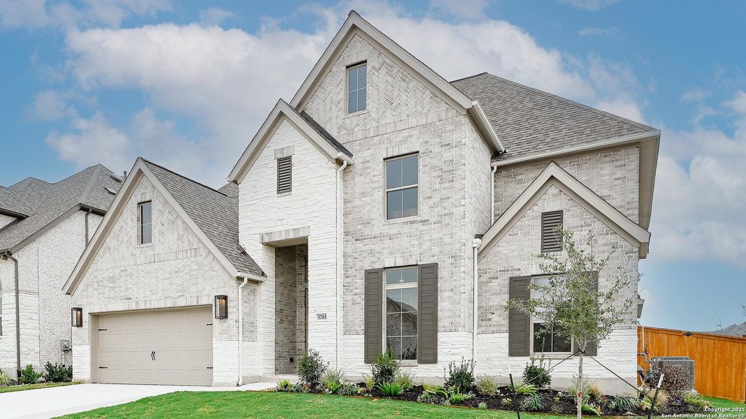 Front exterior of a new home in Mayfair 60', New Braunfels, TX, highlighting curb appeal (Image 2). Front exterior of a new home in Mayfair 60', New Braunfels, TX, highlighting curb appeal (Image 2).