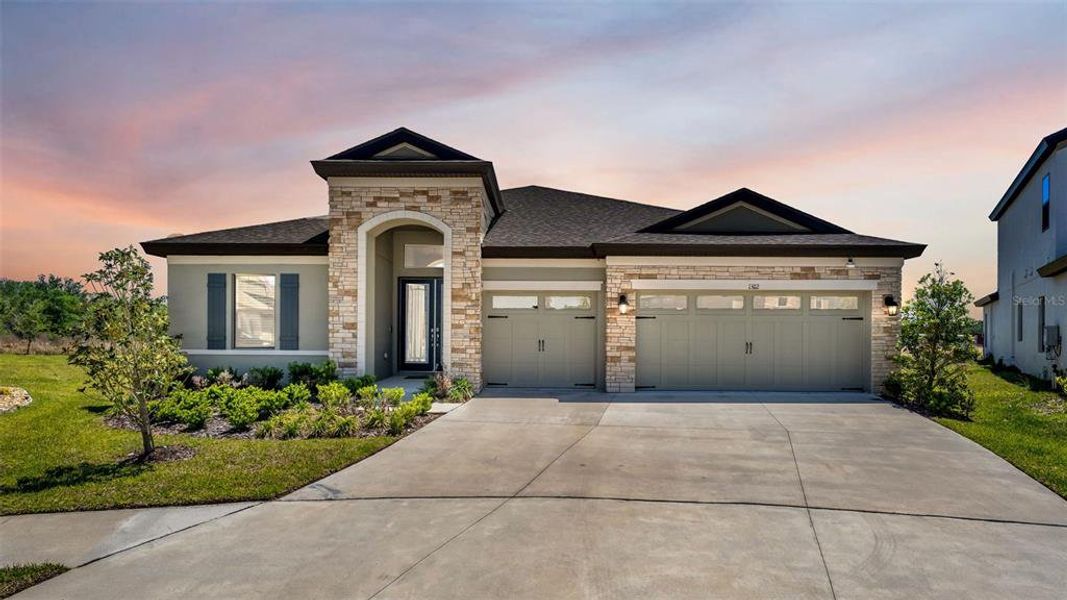Front exterior of a new home in Hawkstone, Lithia, FL, highlighting curb appeal (Image 28).