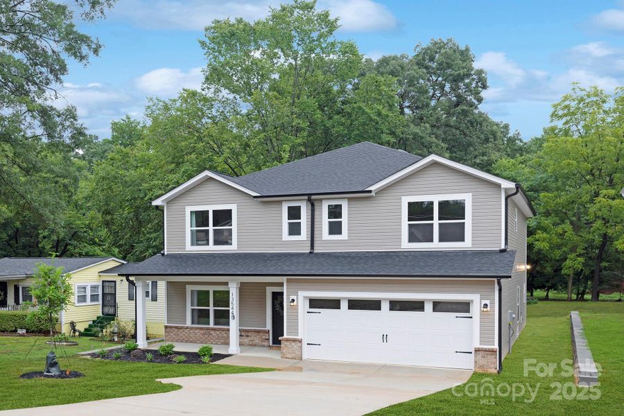 Front exterior of a new home in , Huntersville, NC, highlighting curb appeal (Image 25). Front exterior of a new home in , Huntersville, NC, highlighting curb appeal (Image 25).