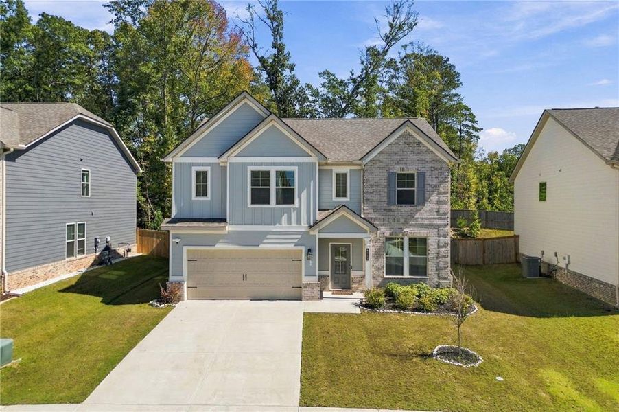 Front exterior of a new home in Dixon Farm, Fayetteville, GA, highlighting curb appeal (Image 27). Front exterior of a new home in Dixon Farm, Fayetteville, GA, highlighting curb appeal (Image 27).