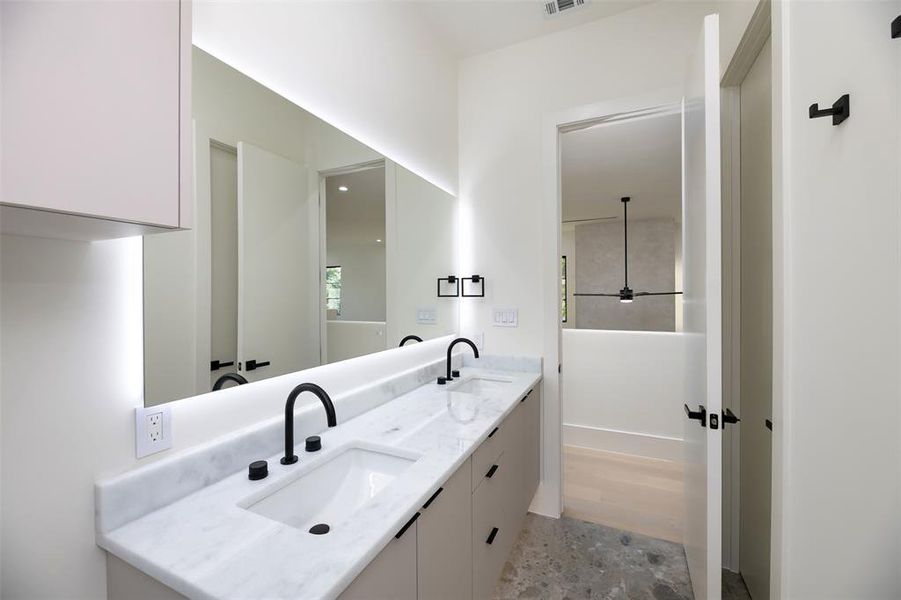 Bathroom featuring double vanity