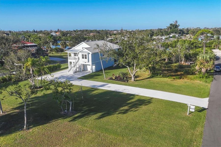 Front exterior of a new home in , Englewood, FL, highlighting curb appeal (Image 26).