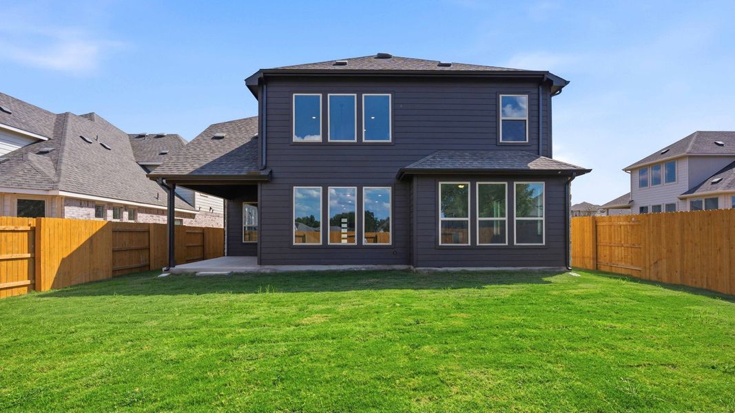 Exterior details and patio area of a home in Oaks at San Gabriel, Georgetown (Image 24).