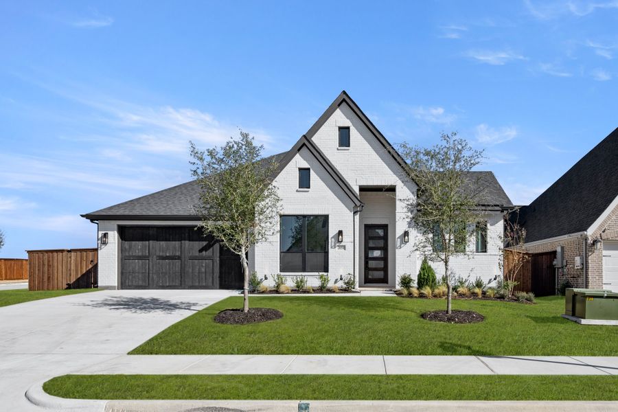 Front exterior of a new home in Bridgewater, Midlothian, TX, highlighting curb appeal (Image 1). Front exterior of a new home in Bridgewater, Midlothian, TX, highlighting curb appeal (Image 1).