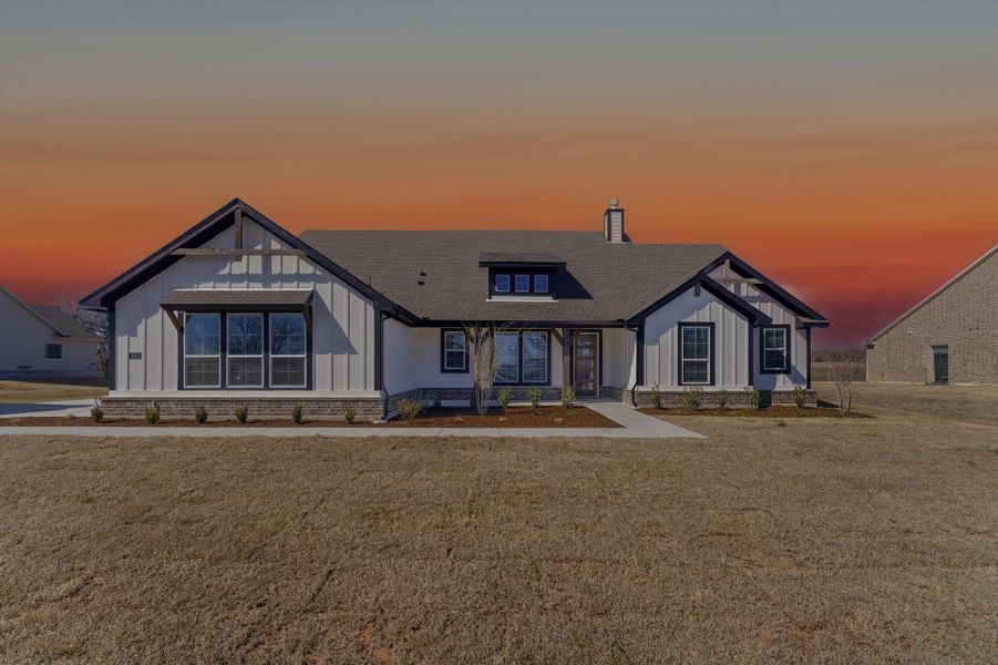 Front exterior of a new home in Terra Escalante, Blue Ridge, TX, highlighting curb appeal (Image 25).