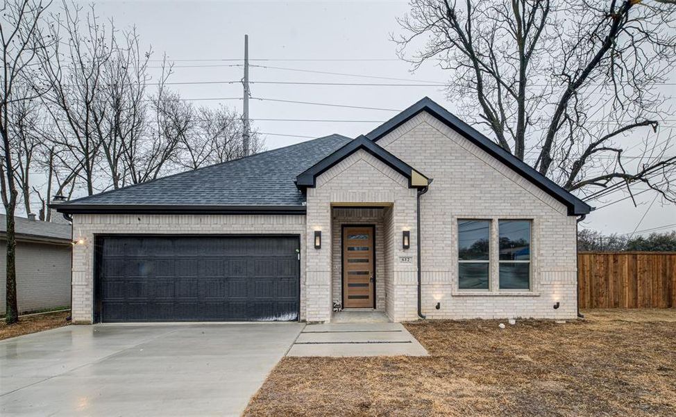 View of front of property with a garage