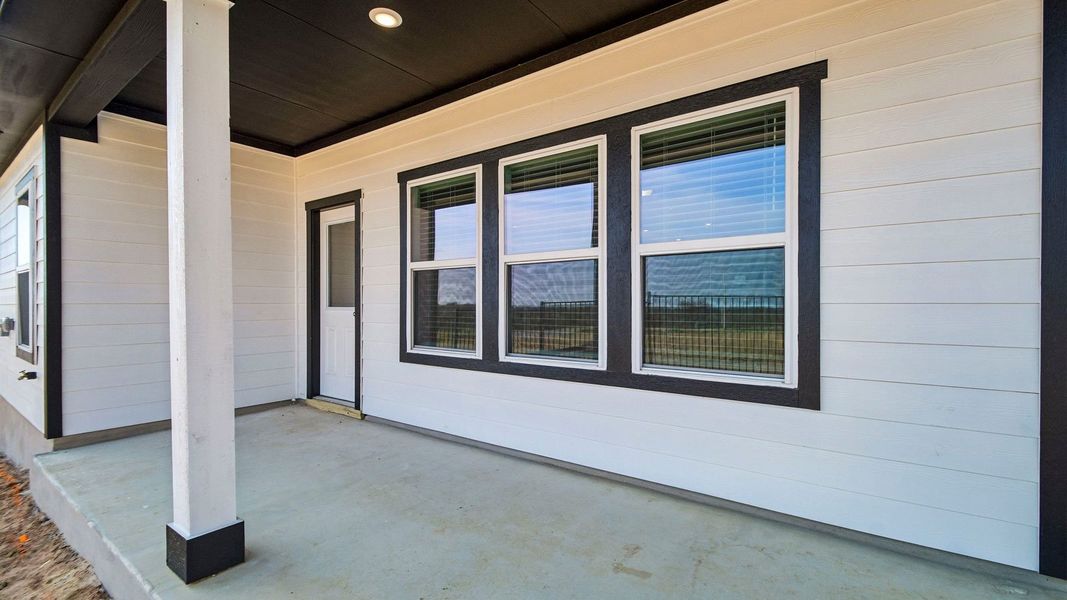 Exterior details and patio area of a home in Revelry, Del Valle (Image 3).
