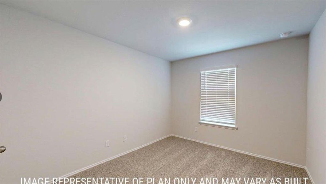 Spacious room with neutral wall tones and carpet flooring