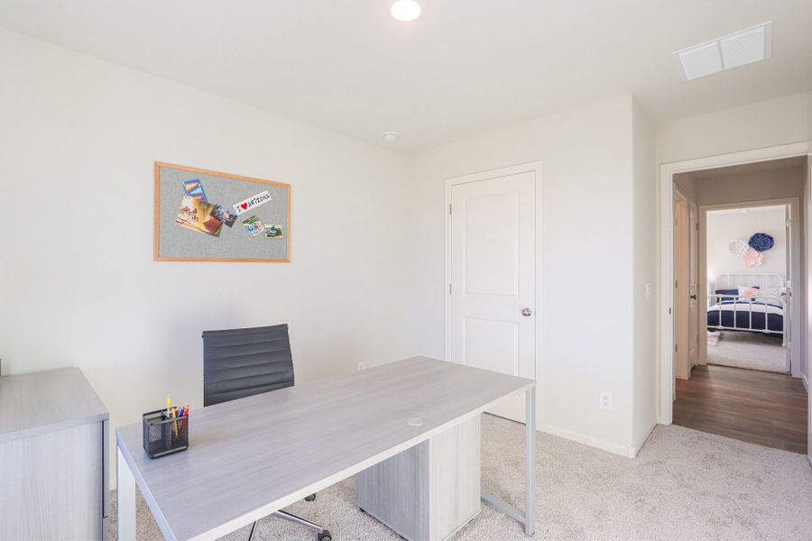 A room with a table and a door. A room with a table and a door.