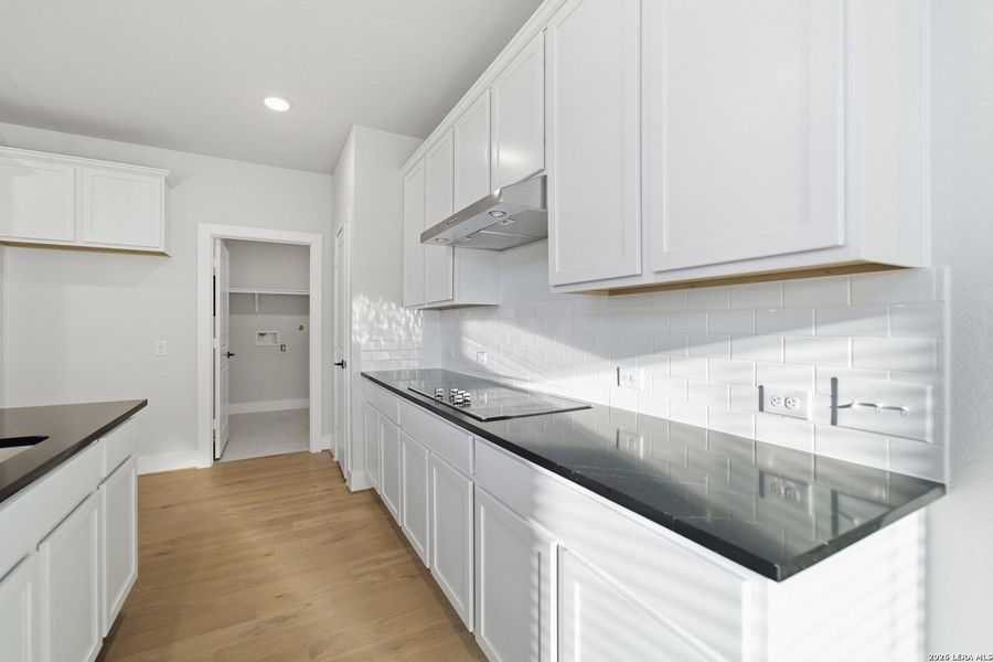 Furnished interior view inside a new home in The Woodlands at Medina Hills, Mico (Image 17).