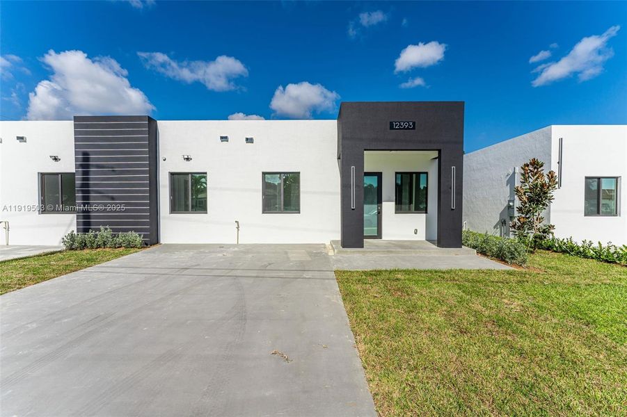Front exterior of a new home in , Miami, FL, highlighting curb appeal (Image 1).