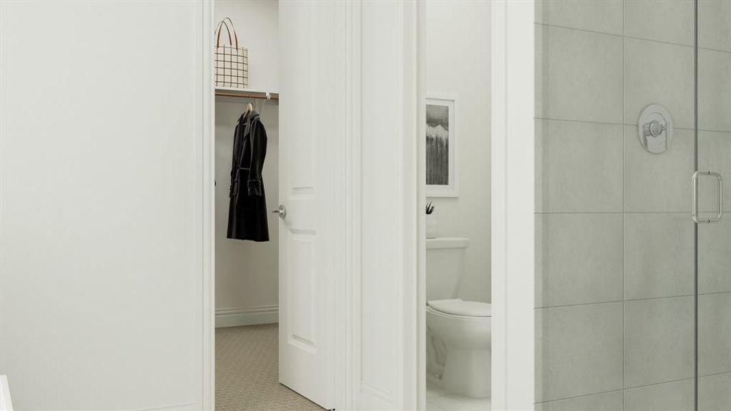 Bathroom with a shower with door, toilet, and tile patterned flooring