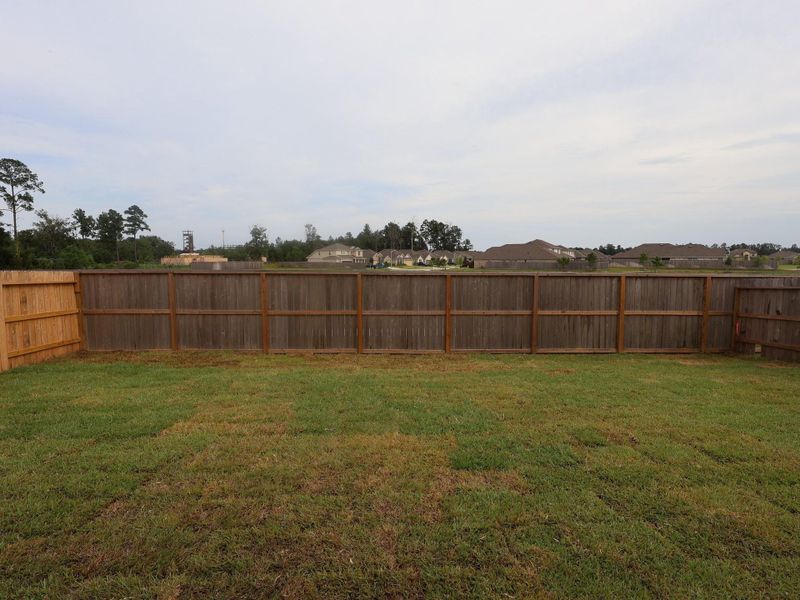 Front exterior of a new home in Pinewood at Grand Texas, New Caney, TX, highlighting curb appeal (Image 10). Front exterior of a new home in Pinewood at Grand Texas, New Caney, TX, highlighting curb appeal (Image 10).