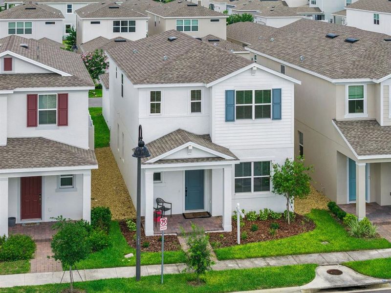 Front exterior of a new home in Osprey Ranch, Winter Garden, FL, highlighting curb appeal (Image 24).