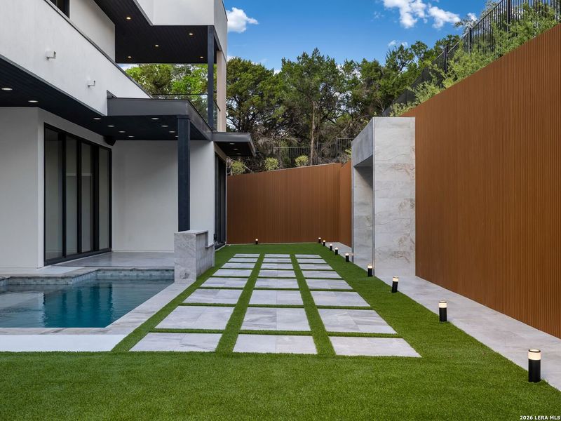 Exterior details and patio area of a home in , San Antonio (Image 38).